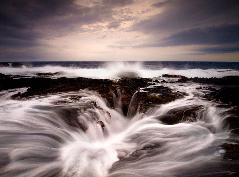 Christopher had this to say about today's photo of the Day: <em>"Keahole Point surf. It was a super overcast end of the day. I am surprised it didn't rain, but there was no chance of a brilliant sunset today. Instead I tried to capture the drama of this location. A large hole in the reef where the surf rushes in and out creates and intense visual show."</em> You can see more of his work <a href="http://www.fromhereonin.com/">here</a>. Want to be featured as our next Photo of the Day? Simply submit you work to our <a href="http://www.flickr.com/groups/1614596@N25/pool/page1">Flickr page</a>.