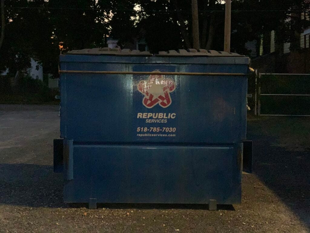 A picture of a dumpster with flash on