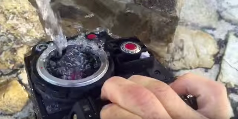 Let’s All Watch This Maniac “Wash” Thousands of Dollars Worth of Camera Gear