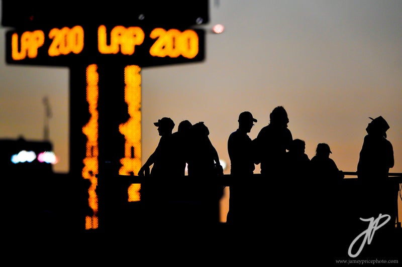 Fans silhouetted at the half way