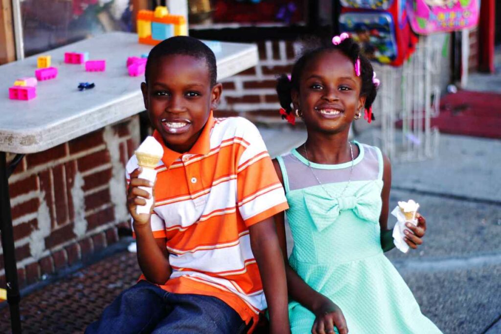 This Photo Is Intended To Capture And Portray The Inner City Vibes On A Late Summer Afternoon. I Took This Shot While Walking Down A Street In Inner-Brookyln, In An Area Where Community Spirit Was Evident And Prevalent. This Shot Was Taken With A Canon Rebel T5i, Lightly Edited In Photoshop, And Shot At An F-Stop Of 2 And An ISO Of 100.