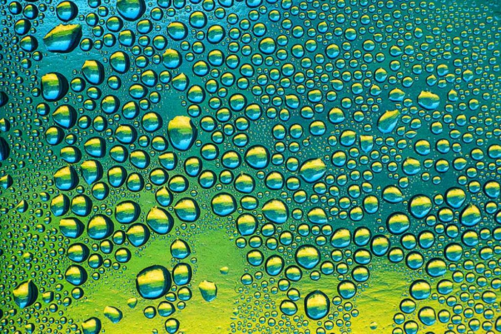 I took this photo inside of my house recently. Last winter we covered our windows with plastic sheeting and left some covered this Summer. These bubbles were formed from the cool air inside the home and the hot air outside. the colors came from the sky, trees and grass outside as well as some reflections from items inside the house. I merely had to enhance the colors a little bit, other than that they are original. Thanks for looking, Mike.