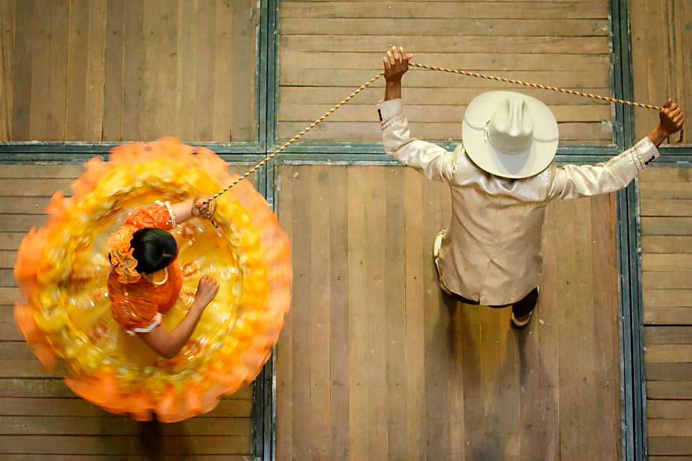 Today's Photo of the Day was captured by Daniel Romero in Medellín, Colombia. Although we are unsure what kind of camera Romero used to document these dancers, we love the overhead perspective on the scene. See more work <a href="https://www.flickr.com/photos/dafero/">here. </a>