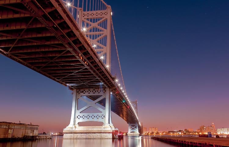 Today's Photo of the Day was shot by Michael Alestra. Michael says this of the image "Taken on my way to work, I drive by the bridge every day. I wanted to capture the scale and detail of the bridge and I was able to get a shot from almost directly underneath. The water was very still and had great reflections."