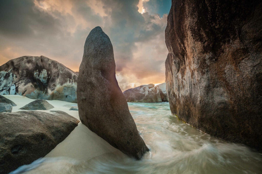 A beautiful sunset in Spring Bay in the British Virgin Islands.  The rocks in the foreground provide the perfect composition for the scene.