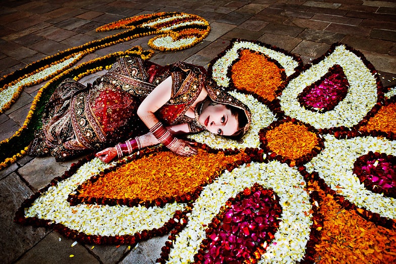 This photo was taken at Samode Palace, India (about an hour from Jaipur). As the bride walked down to see the entrance of the groom, I asked her if she'd be willing to get on the ground to lie in the flowers. She said yes, so I got on the ground, showed her what I was envisioning, and then she just did exactly what I had shown her. This is my favorite kind of bride – the one that trusts me when I ask them to do random stuff.