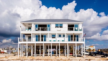 Hurricanes destroy beachside homes, but not this one