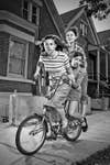 three girls riding one bike