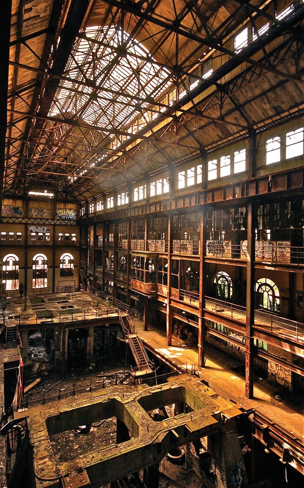 sun beaming through the rafters of this abandoned New York power plant