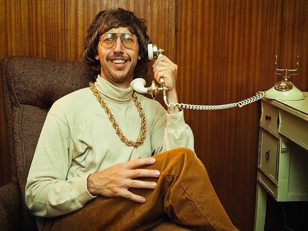 nerdy seventies man on telephone