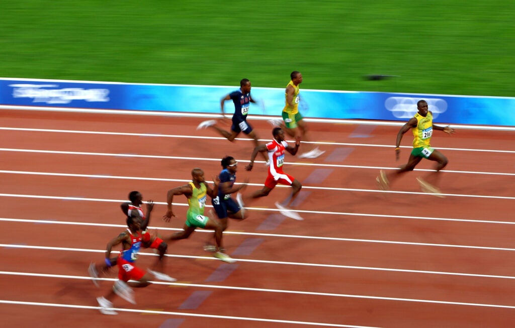 Usain Bolt of Jamaica (R) celebrates as he approaches the line on his way to winning the Menâs 100m Final the Beijing 2008 Olympics on Aug. 16, 2008. He clocked a new world record time of 9.69 sec.