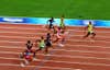 Usain Bolt of Jamaica (R) celebrates as he approaches the line on his way to winning the Menâs 100m Final the Beijing 2008 Olympics on Aug. 16, 2008. He clocked a new world record time of 9.69 sec.