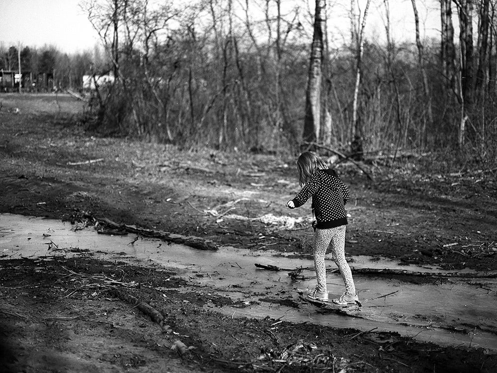 black and white photo of person walking