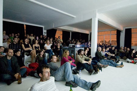 Slideluck-Potshow-Slideluck-attendees-watch-a-sli