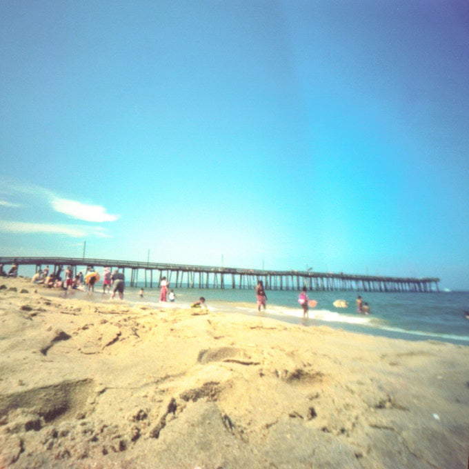 long exposure photo of people on beach