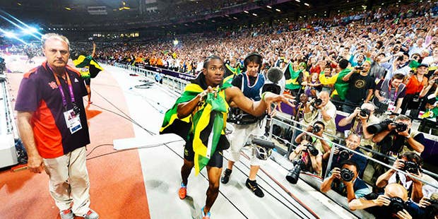 Usain Bolt Celebrates Another Gold Medal By Grabbing a Nikon D4 And Taking Picture