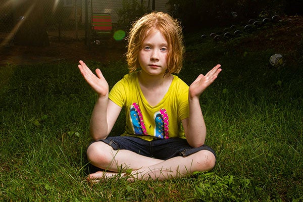 child sitting cross-legged