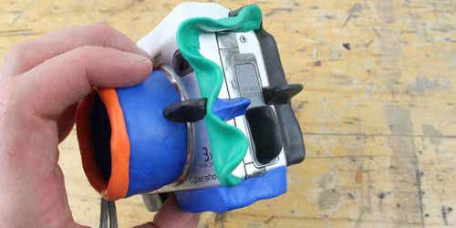 Turn a Regular Compact Into a Rugged One Using Cheap Rubber Putty