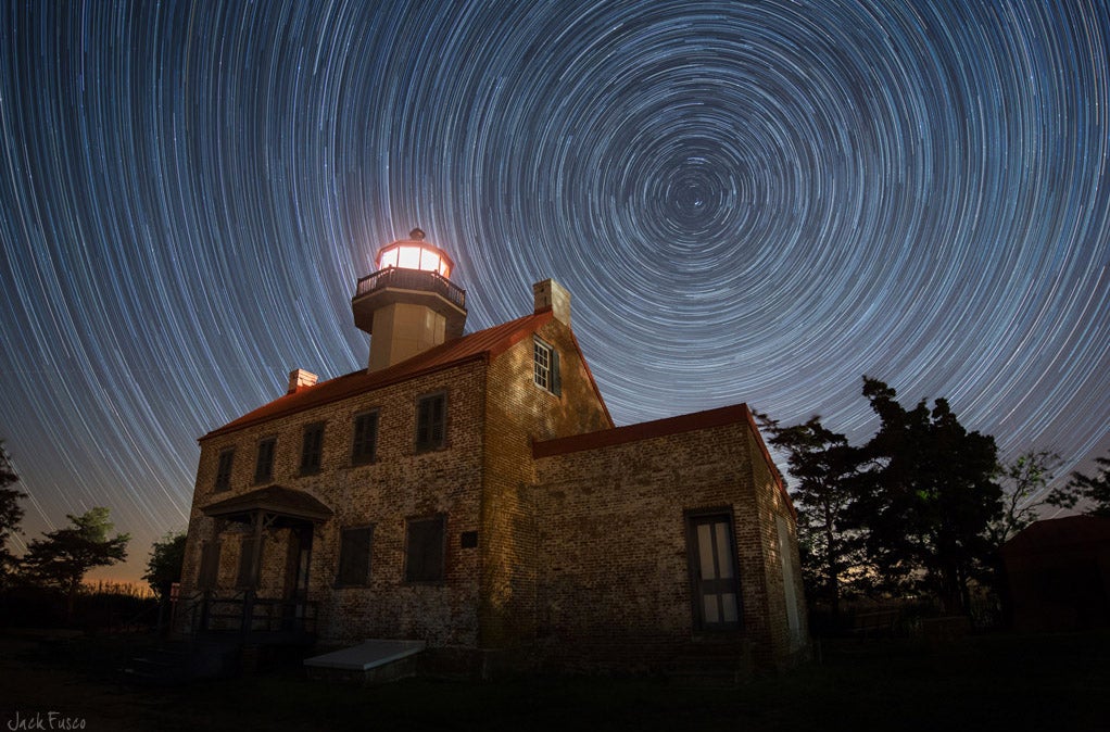 Jack Fusco captured these star trails at the East Point Lighthouse in New Jersey during the Camelopardalid meteor shower on a Nikon D800e. "I had originally planned to make my way out to much darker skies, but the poor weather forecast changed my plans a few times," Jack writes. "I think I saw 2 meteors and caught 3 the entire night. Definitely a let down in those terms, but still a great night out shooting." See more of Jack's work <a href="http://www.flickr.com/photos/xclearmindx/">here.</a> Want to be featured as our next Photo of the Day? Simply submit your work to our <a href="https://www.flickr.com/groups/1614596@N25/pool/page1">Flickr page.</a>