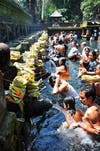 Worshippers making offerings or praying