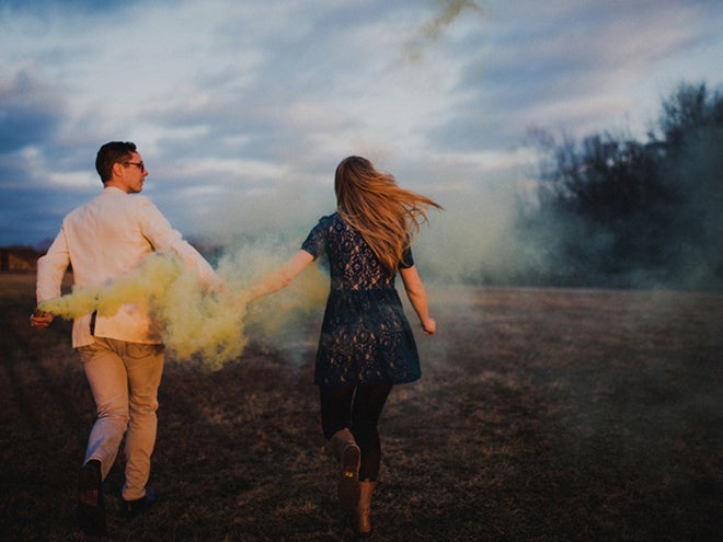 Releasing yellow smoke into the wind