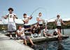 group of people fishing in boat