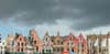 Photo: CLAIRE THORNE Bruges's colorful Grote Markt in Belgium being threatened by storm clouds. CAMERA: Sony DSC-H9