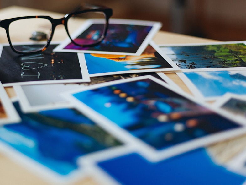 glasses on a stack of photos