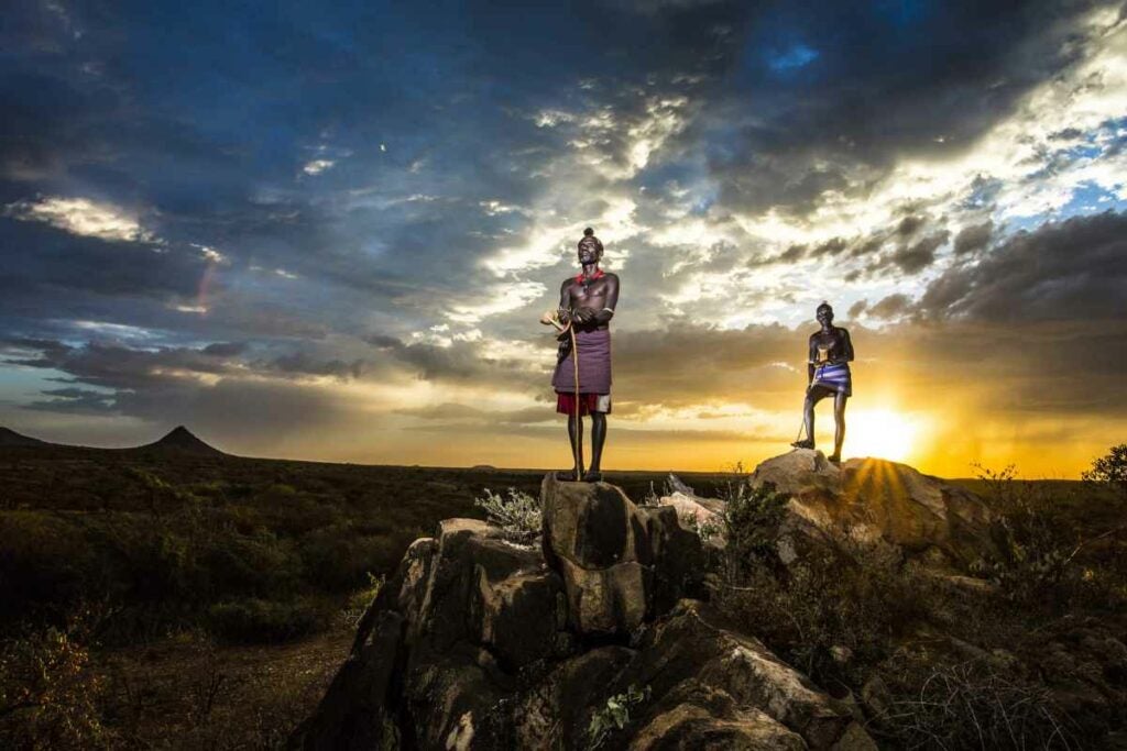 Two Hamer tribe shepherdes observing the Omo valley.