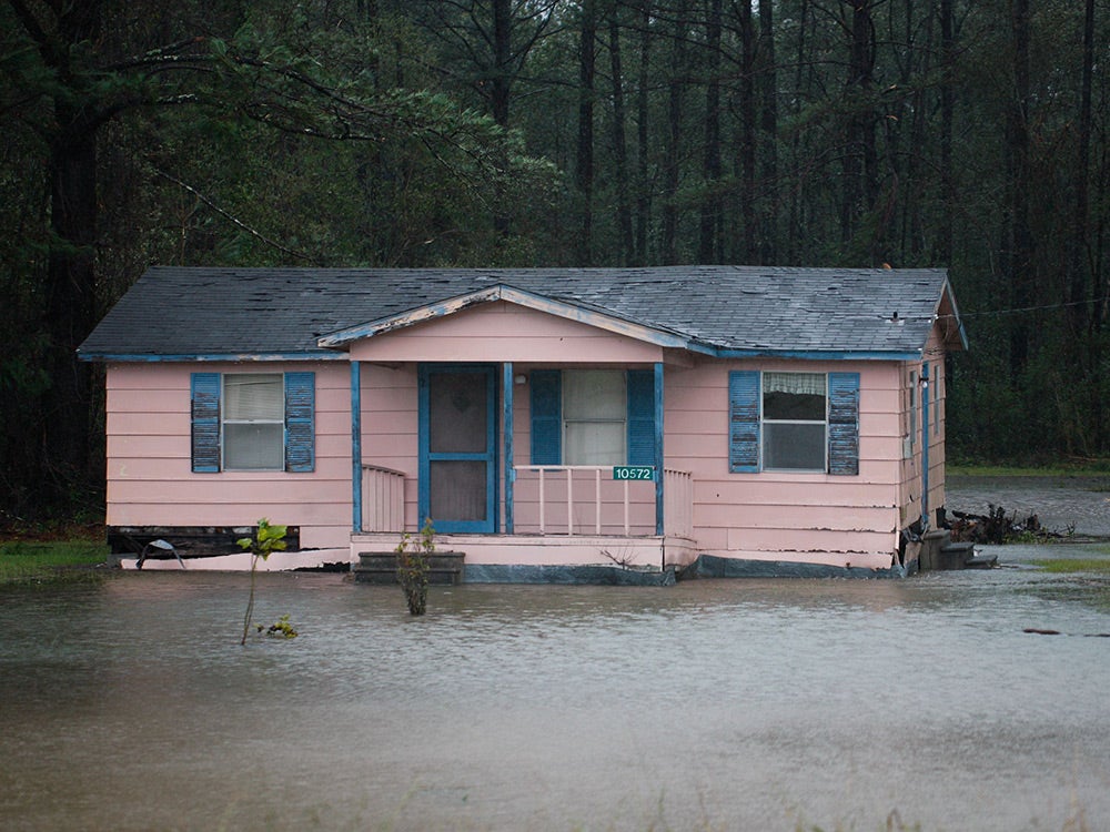 home sitting in flood water