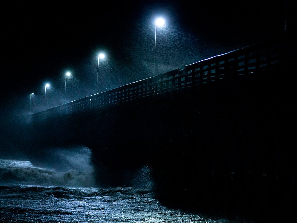 Waves crash into the Second Avenue Pier