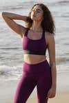 woman stretching on beach