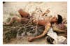 Young boy laying on the beach