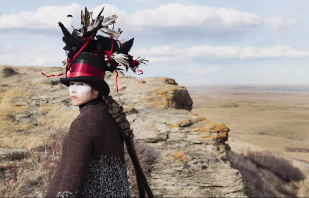 woman in a feathered tophat