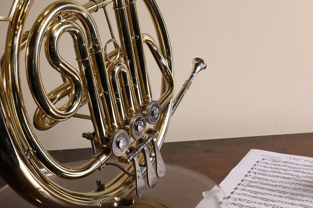 french horn and sheet music