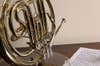 french horn and sheet music