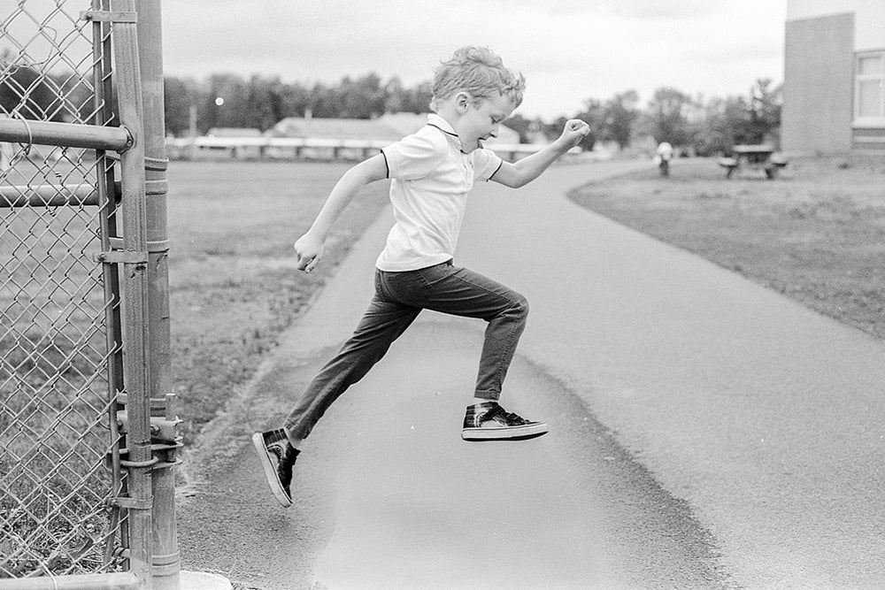 ian jumping in black and white