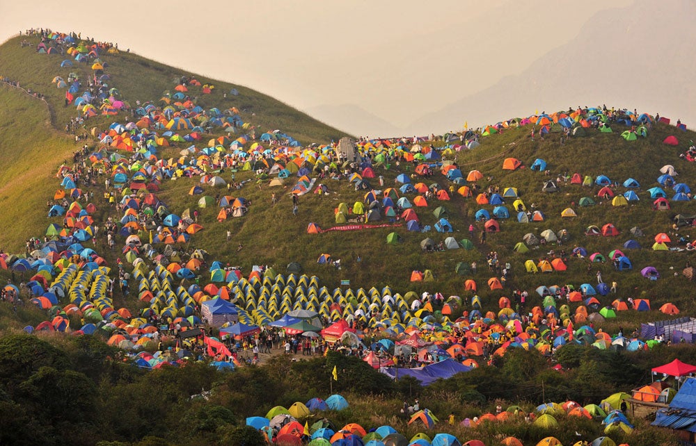 Numerous tents are seen during the 2013 International I Camping Festival in Mount Wugongshan of Pingxiang, Jiangxi province, September 14, 2013. The event which opened on September 14 attracted more than 15,000 campers all over the world, according to Xinhua News Agency. Picture taken September 14, 2013. REUTERS/Stringer (CHINA - Tags: SOCIETY ANNIVERSARY) CHINA OUT. NO COMMERCIAL OR EDITORIAL SALES IN CHINA - RTX13O4D