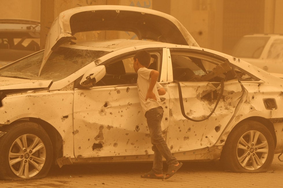 An Iraqi boy examines a destroyed vehicle in Baghdad's Haifa Street, the result of a car bomb. Ahmad Al-Rubaye is an AFP staff photographer based in Baghdad. You can see more of his work covering daily life in Iraq on his <a href="http://www.flickr.com/photos/22821042@N02/">Flickr page</a> as well as on AFP's <a href="http://portfolios.afp.com/photographers/region/middle-east/ahmad-al-rubaye.html">portfolio site</a>.