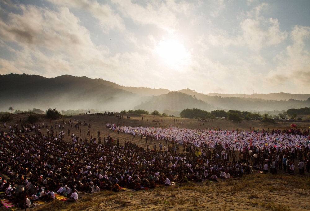 People attend Eid al-Fitr prayers at Parang Kusumo beach, near the ancient city of Yogyakarta August 8, 2013. Indonesia, which has the world's largest Muslim population, celebrates Eid al-Fitr with mass prayers and family visits to mark the end of the Muslim holy fasting month of Ramadan. REUTERS/Ignatius Eswe (INDONESIA - Tags: RELIGION TPX IMAGES OF THE DAY) - RTX12DL9