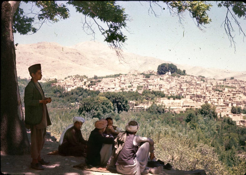 A group of Afghan men look out over Istalif, about 18 miles northwest of Kabul, which was a centuries-old center of pottery making as well as other tourist attractions. The village was nearly destroyed by major fighting between "Northern Alliance" forces and the Taliban in the late 1990s.