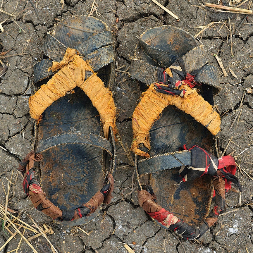 From A Long Walk, the sandals of Saddam Omar, 25, who walked for eight days from Pi.