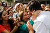 Venezuela's opposition presidential candidate Henrique Capriles is mobbed by supporters after he voted in the presidential election pitting him against President Hugo Chavez. Chavez ultimately won reelection. Carlos Garcia Rawlins is a Venezuela-based photojournalist working for Reuters. Check out more of his incredible work <a href="http://www.photorawlins.com/">here</a>.