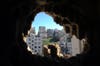 Dimitar Dilkoff, an AFP staff photographer based in Europe, captured this view of the northern Lebanese city of Tripoli through a hole in a building made by a rocket-propelled grenade. For months, Lebanese Sunni Muslims, hostile to Syria’s regime, have clashed with Alawites who support the regime.