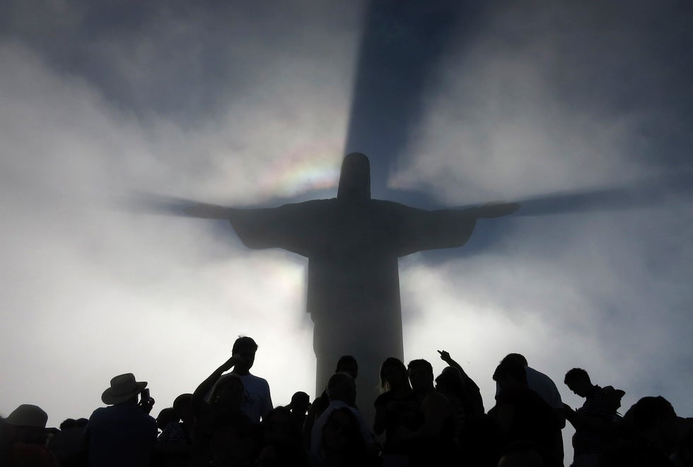 The Christ the Redeemer statue casts a shadow on passing clouds atop of Corcovado mountain in Rio de Janeiro. Gary Hershorn is a 28-year Reuters veteran from Hoboken, New Jersey. See more of his incredible work <a href="http://blogs.reuters.com/gary-hershorn/">here</a>.