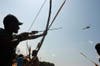 Amazonian Indians and fishermen react as a helicopter flies over a protest against the construction of the Belo Monte hydraulic dam in Brazil. Locals took to blockading machinery used in construction to make their point. So far, their attempts have successfully halted the job. Lunae Parracho is a Brazilia-based photojournalist stringing for Reuters.