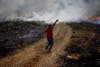 A Palestinian protester uses a sling to throw stones at Israeli troops during clashes near the West Bank village of Deir Jarir. Mohamad Torokman is a Palestinian-based photojournalist shooting for Reuters.