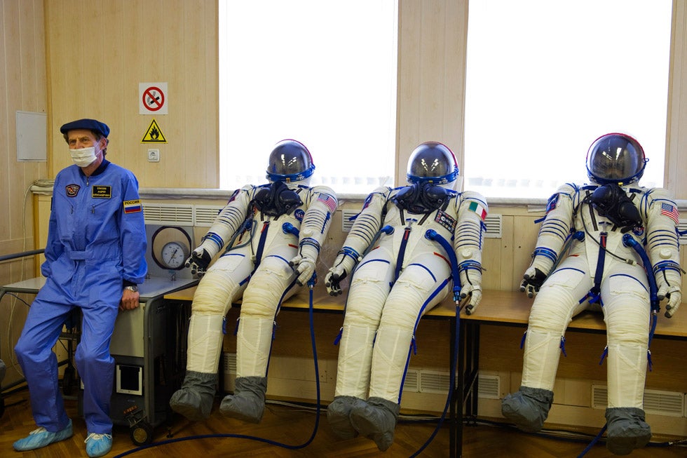 A specialist sits next to inflated space suits prepared for the International Space Station (ISS) crew members during a training at Baikonur cosmodrome. Sergei Remezov is a Russian-based photographer who shoots the space industry for a wide variety of media organizations.