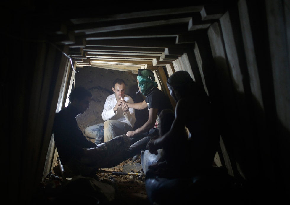 Palestinians smoke cigarettes as they work inside a smuggling tunnel dug beneath the Egyptian-Gaza border in Rafah, in the southern Gaza Strip. Mohammed Salem is a Reuters photographer based in Palestine. See more of his work in our <a href="http://www.americanphotomag.com/photo-gallery/2012/09/photojournalism-week-september-14-2012?page=4">past round-up</a>.