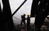 Fire fighters struggle to put out a fire at the Jomo Kenyatta International Airport in Kenya's capital Nairobi August 7, 2013. A fire engulfed Kenya's main airport on Wednesday, choking a vital travel and trade gateway to east Africa, witnesses and officials said. The cause of the fire was not yet known. REUTERS/Noor Khamis (KENYA - Tags: DISASTER TRANSPORT) - RTX12CJX